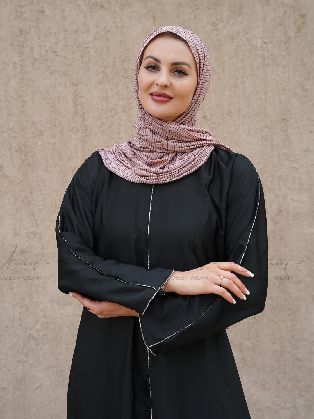 Modest black abaya featuring luxurious stone lace embellishments