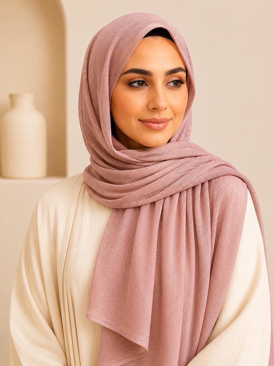 Model wearing dusty pink premium modal hijab with soft elegant drape